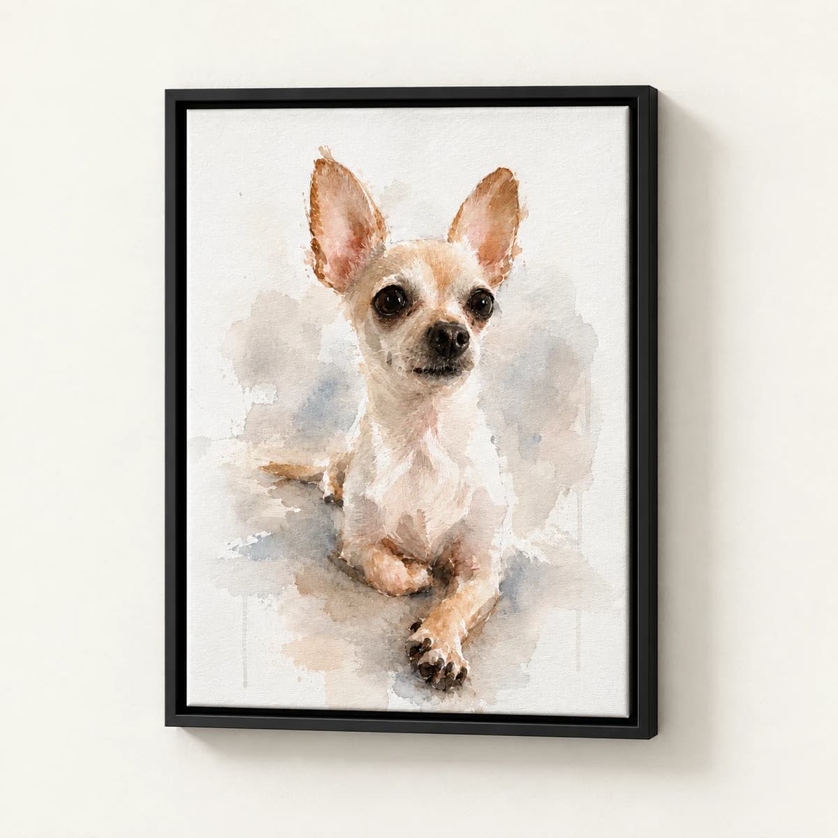 Watercolor custom pet portrait in a black floating canvas frame on an ivory wall